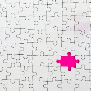 Pink jigsaw piece Grey jigsaw with one missing piece suggestion that the Better Marketing Consultancy service will fill the gap