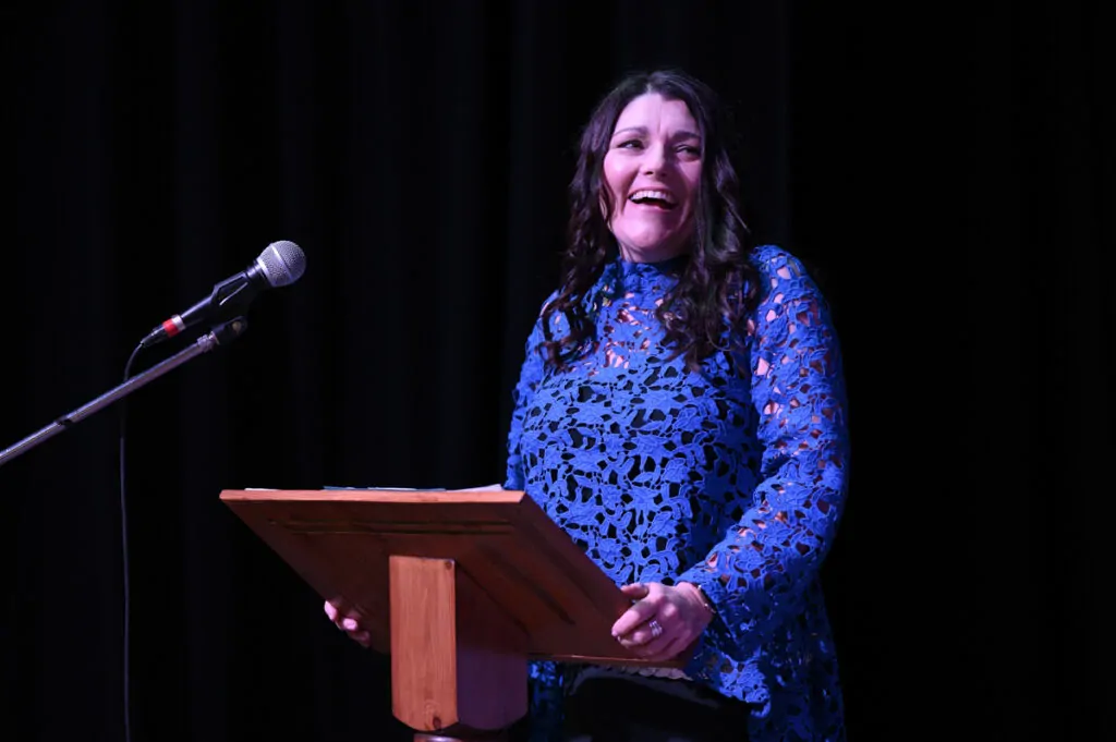 Tracy R Awards 22 Looking away laughing Tracy Heatley in action on stage as a speaker addressing the audience