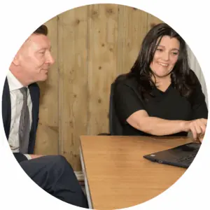 Tracy & Paul OMD Web page Tracy Heatley with a financial services client discussing marketing strategy and implementation
